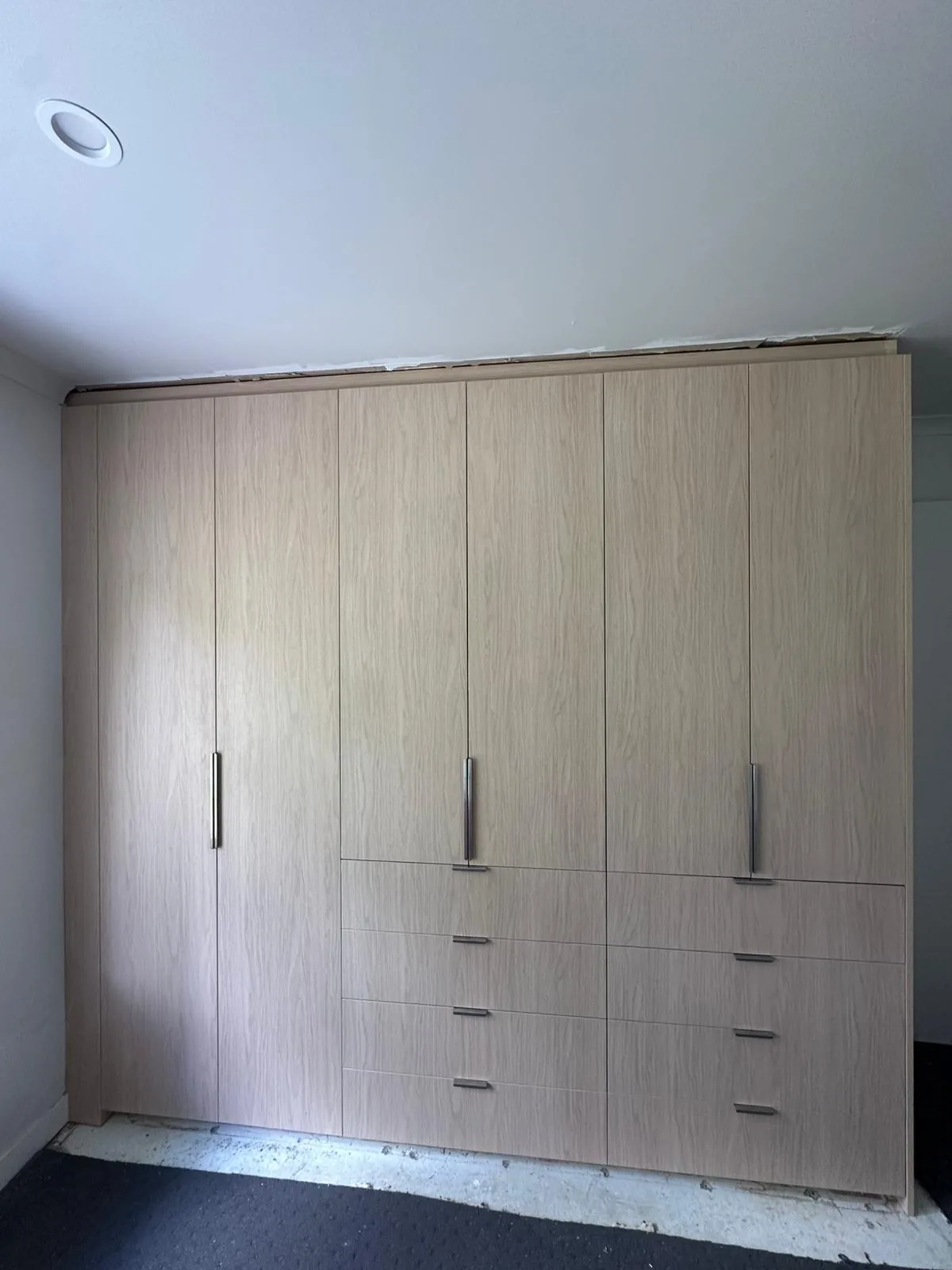 Full-height oak built-in wardrobe with drawers