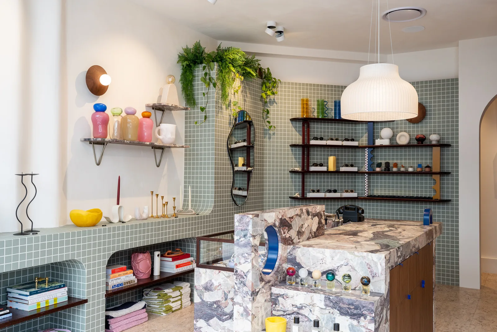 Retail store fitout with marble counter and tiled shelving