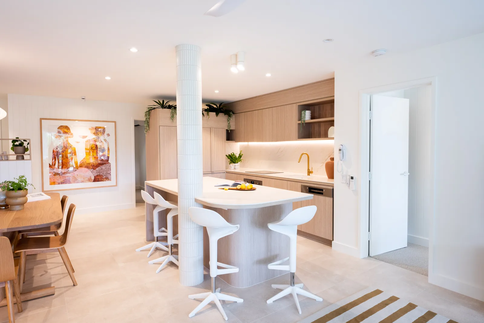 Kitchen with tiled column and stone island