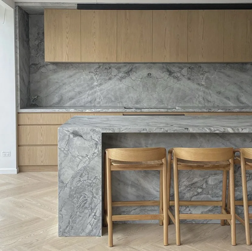 Kitchen with stone island and timber cabinetry