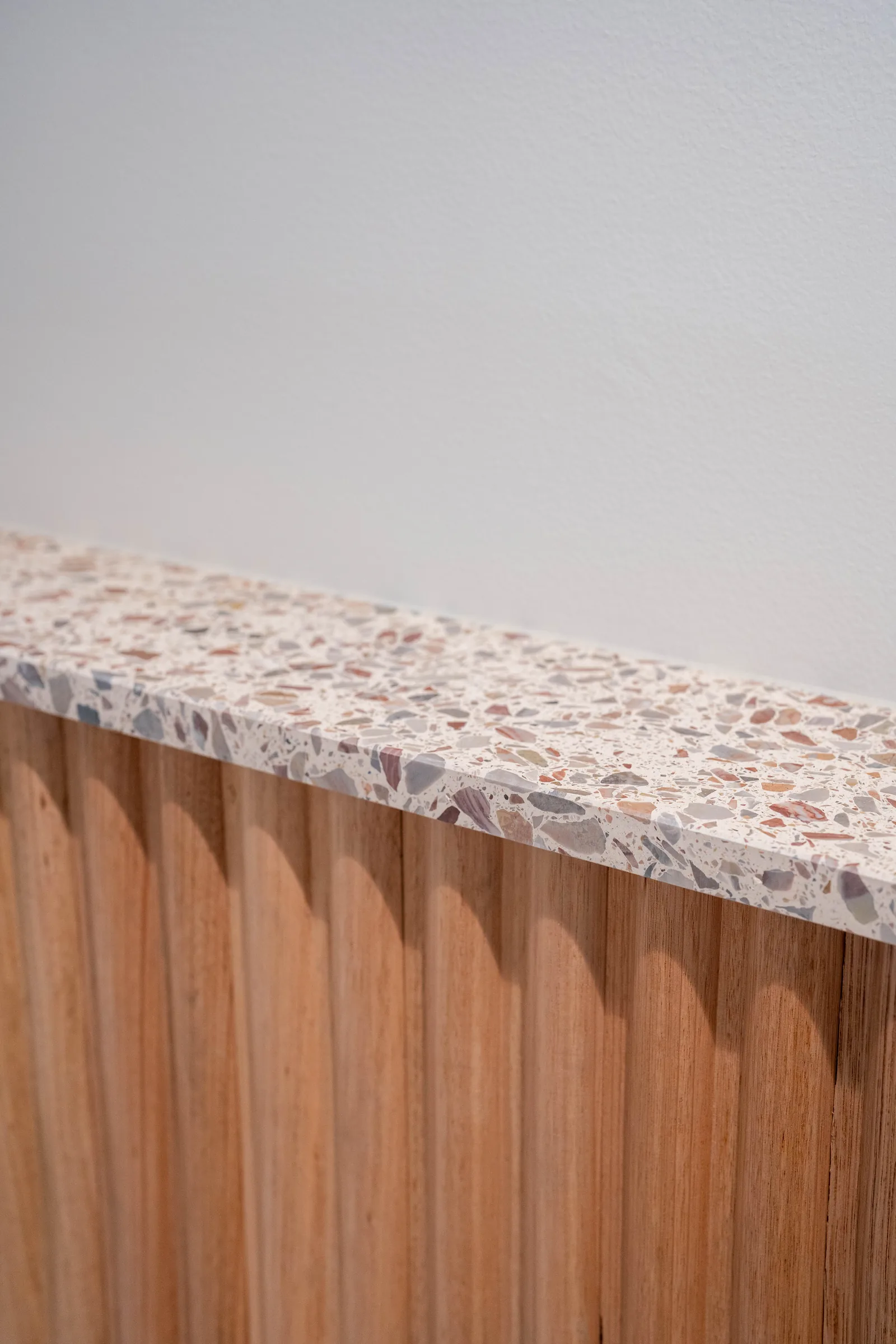 Fluted timber bedhead with terrazzo ledge, Noosa Crest
